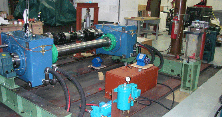 Back-to-back gearbox test rig with two blue gear housings connected by shafts